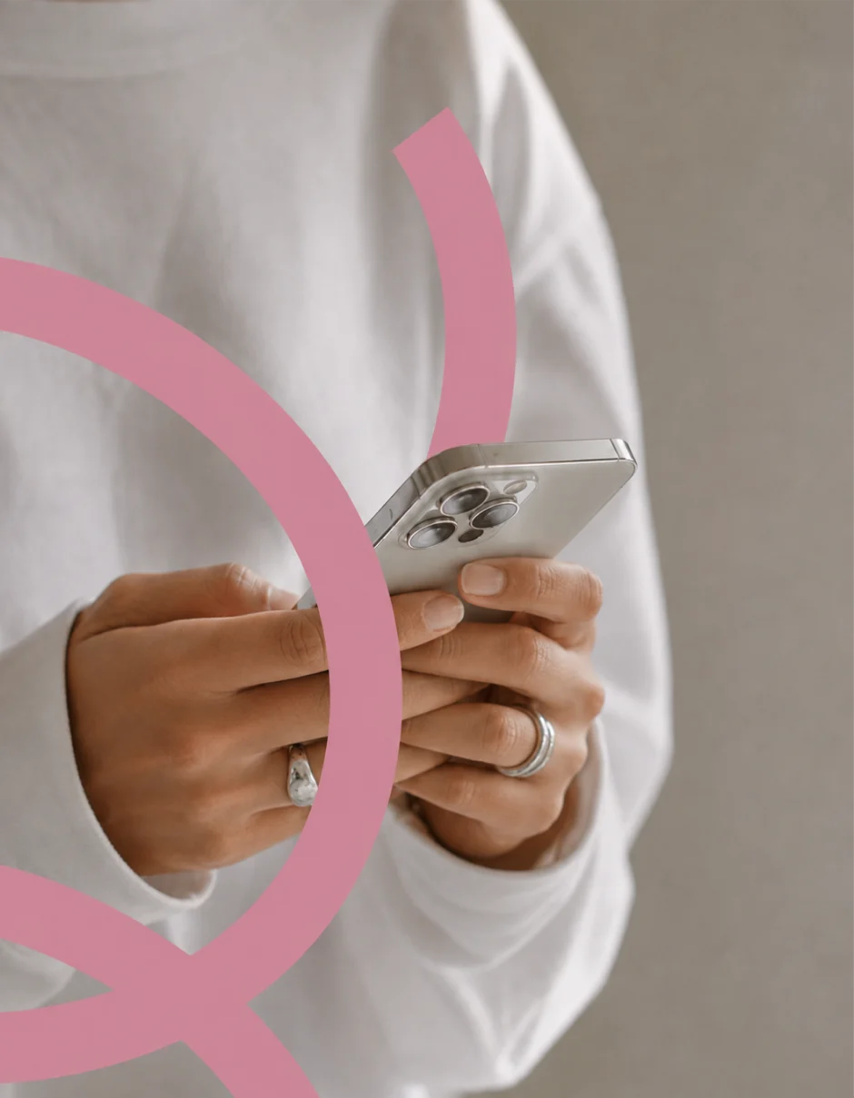 A woman types on her phone to contact the centre