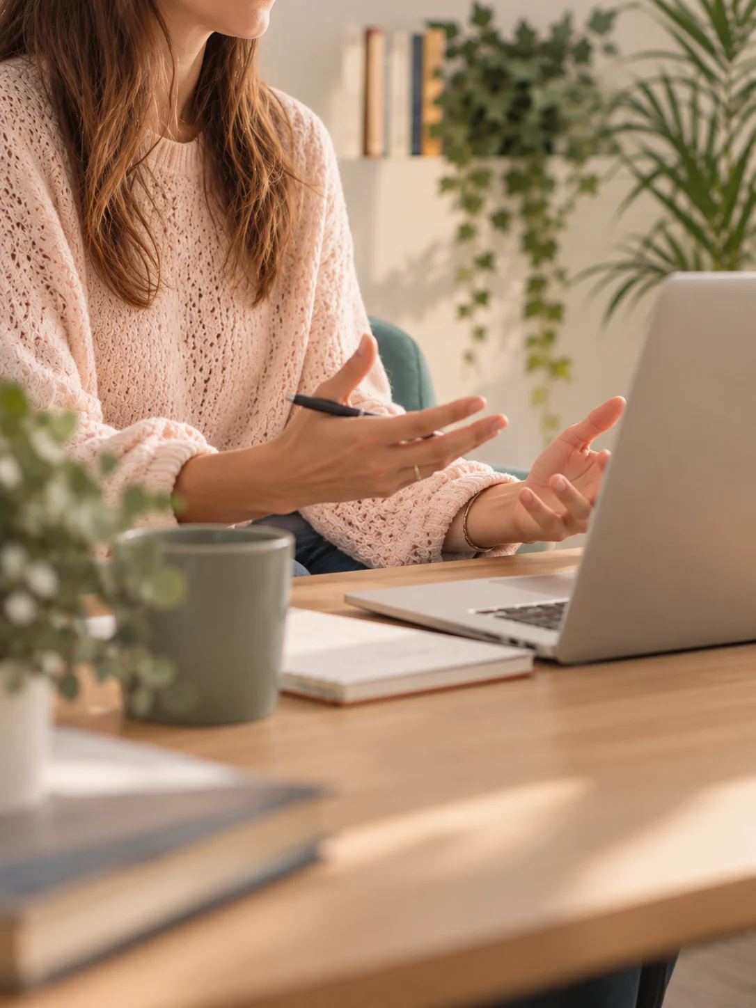 Psychologist in an online therapy session, in front of her laptop